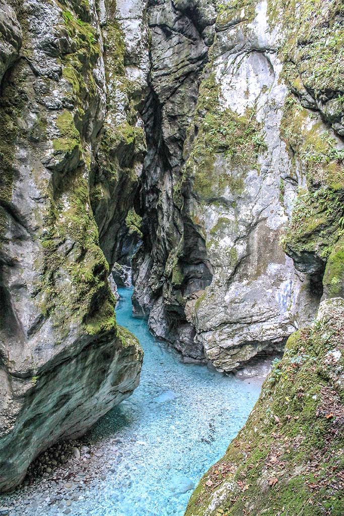 Clear aqua water in Tolmin Gorge, Slovenia. This gorge is one of the top sights to visit in Triglav National Park and the Julian Alps region of Slovenia.