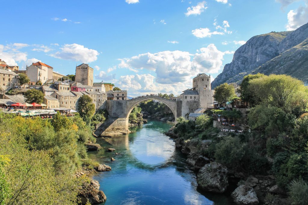 View of Stari Most in Bosnia and Herzegovina from Koski Mehmed Pasha Mosque. This bridge is the highlight of a day trip to Mostar from Dubrovnik.