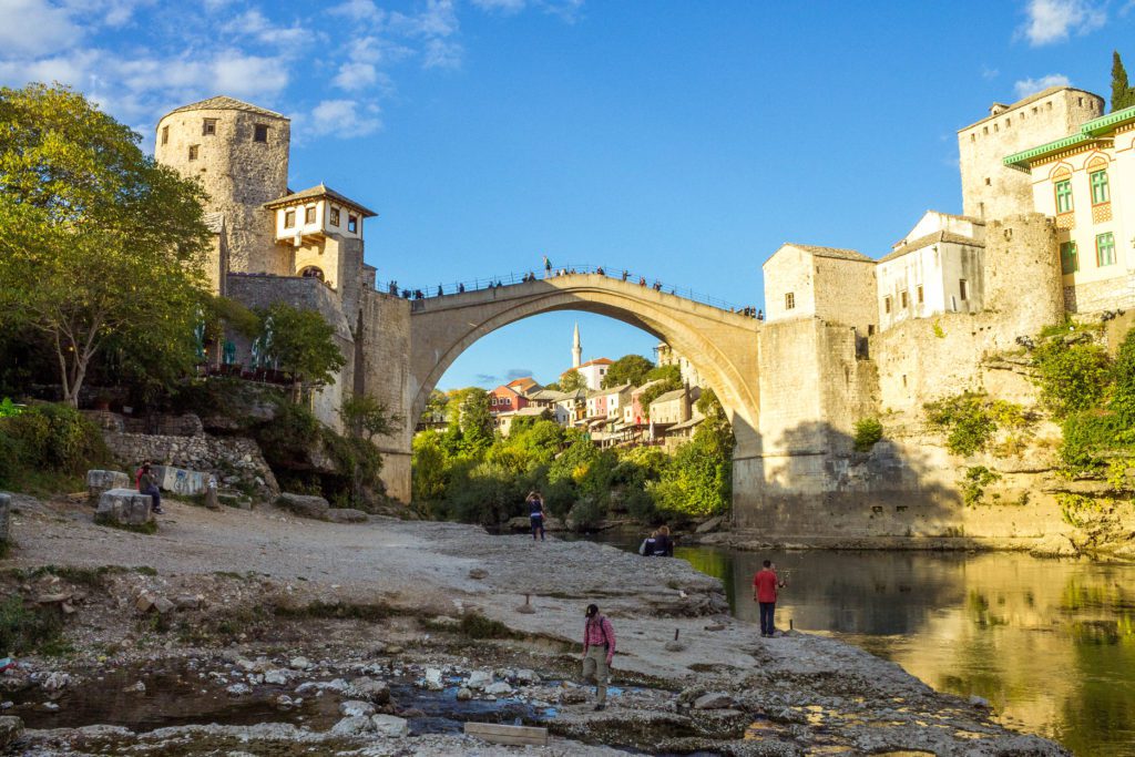 View of Stari Most and Neretva River in Mostar, Bosnia and Herzegovina. This is a beautiful bridge in Bosnia. Mostar is one of the best day trips you can do from Dubrovnik.