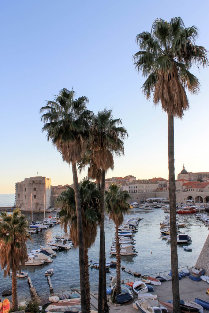 Walking around the old harbor of Dubrovnik gives you sights like this one if you go around sunset. It's a beautiful city to visit on Croatia's coast