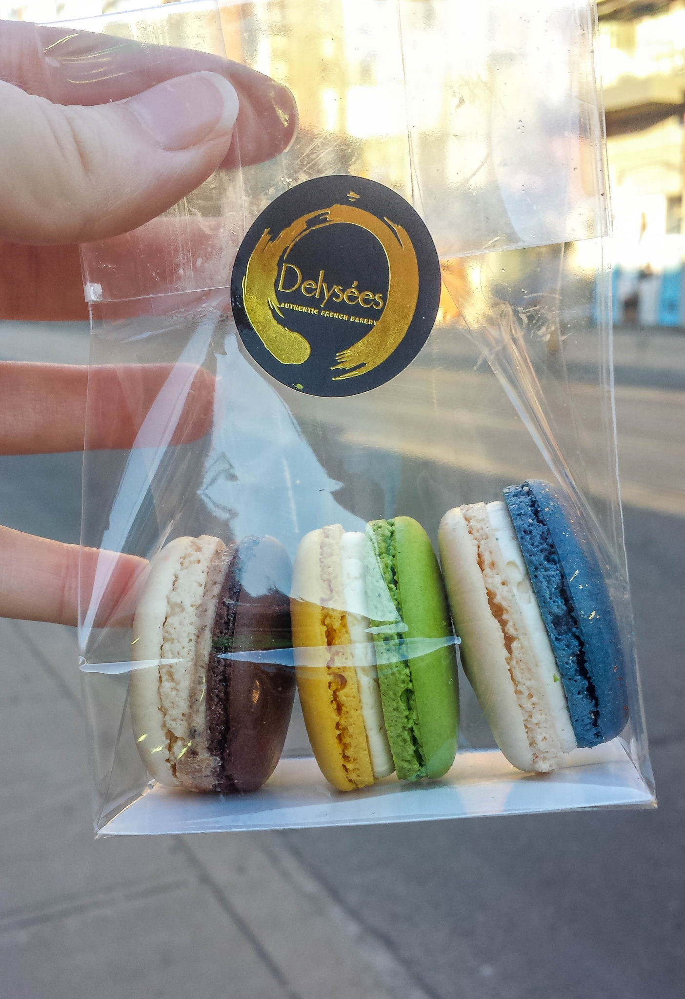 Three macarons in a clear plastic bag from Delysees Toronto