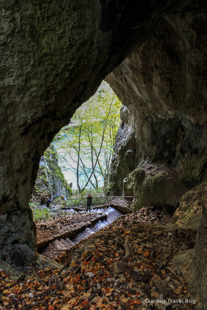 While exploring Plitvice Lakes in Croatia you may be surprised to discover a small cave. There is this one above as well as caves below the water. It's worth walking through this cave to get a view from the cliffs above. 