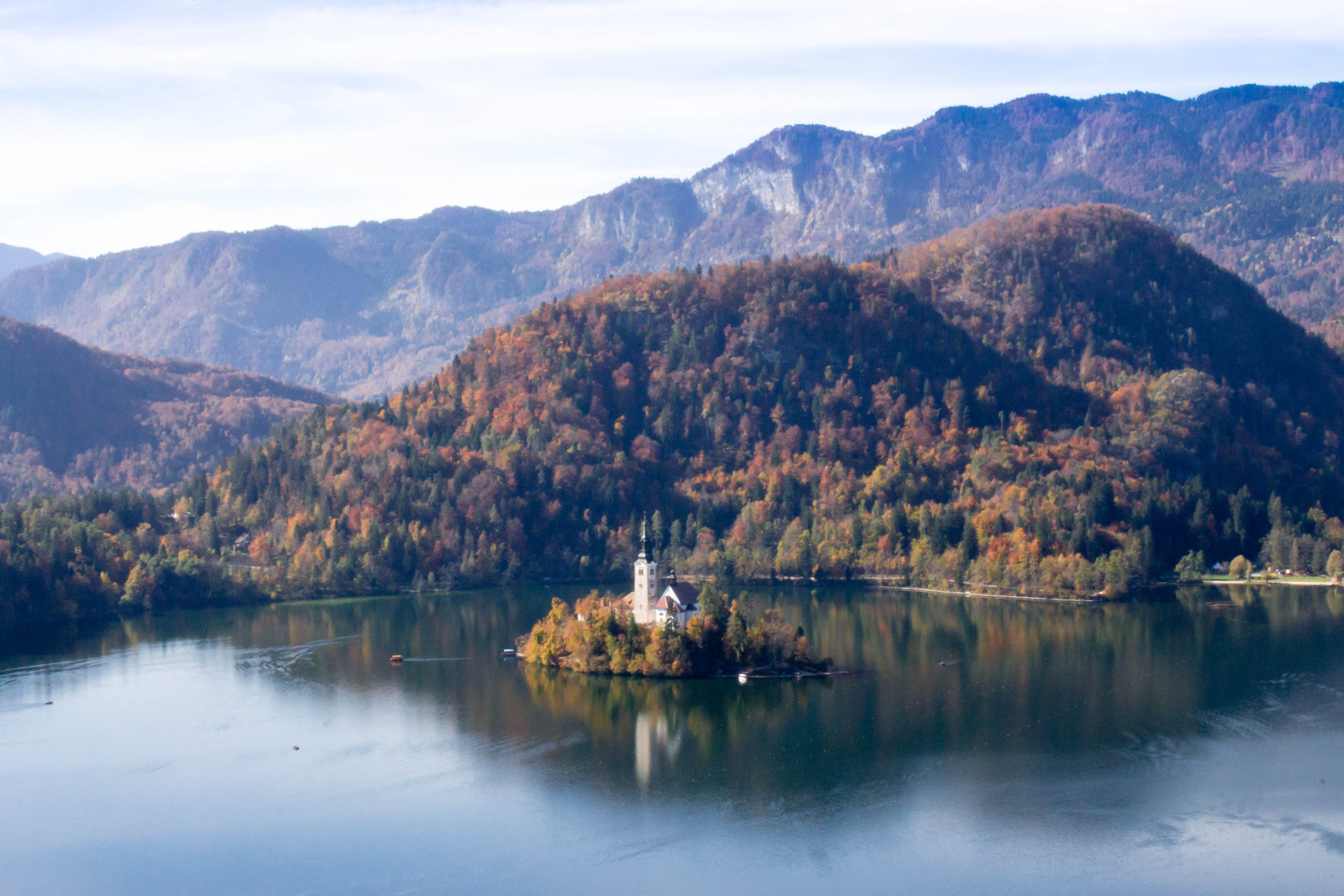 Lake Bled and Vintgar Gorge in Slovenia makes for a fairy-tale like destination as a day trip. Between a church set in the middle of a lake, a castle perch high on a cliff, and the stunning boardwalk through the gorge, Bled is a fantastic place to explore Europe from #Europe #Slovenia #Castle