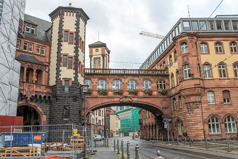 Back of Romer, sandstone building with arched bridge over street Frankfurt am Main, Germany