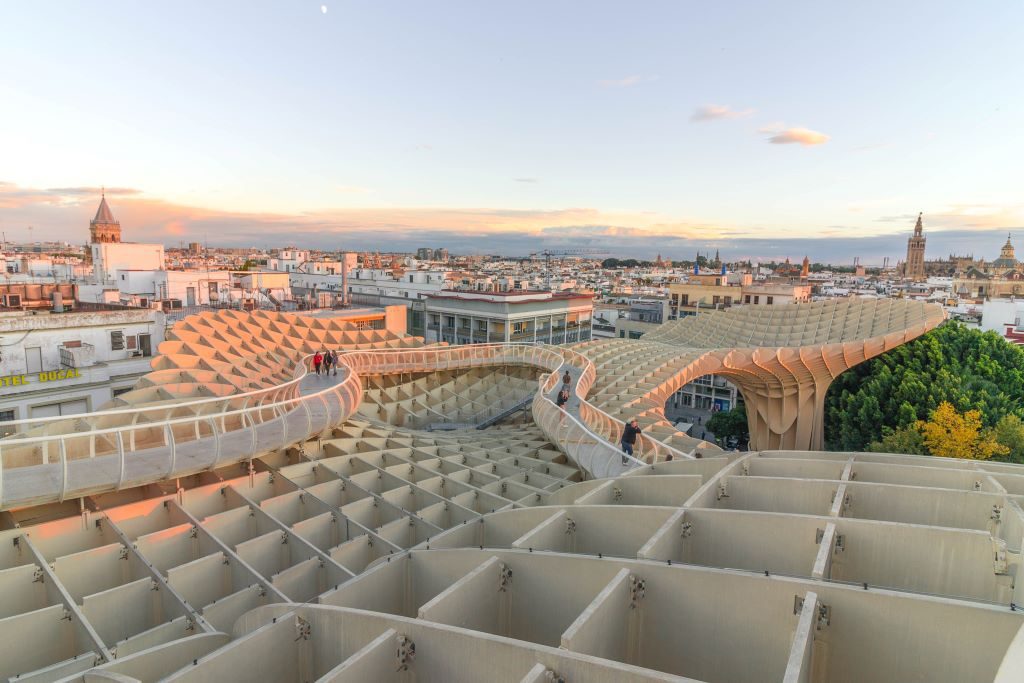 View of the city of Seville and the Metropol Parasol at sunset. This is one of the most popular places to watch the sunset in Seville.