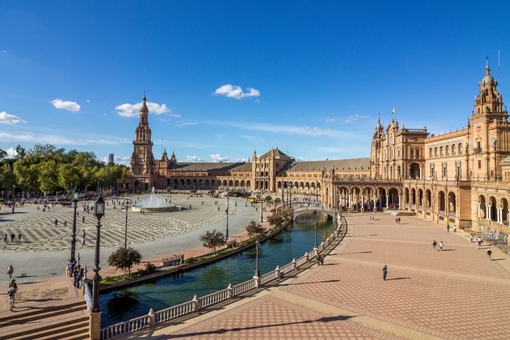 A full view of the Plaza de Espana in Seville. This large square was originally built for the 1929 World Fair and is now one of Seville's top things to visit in the city.