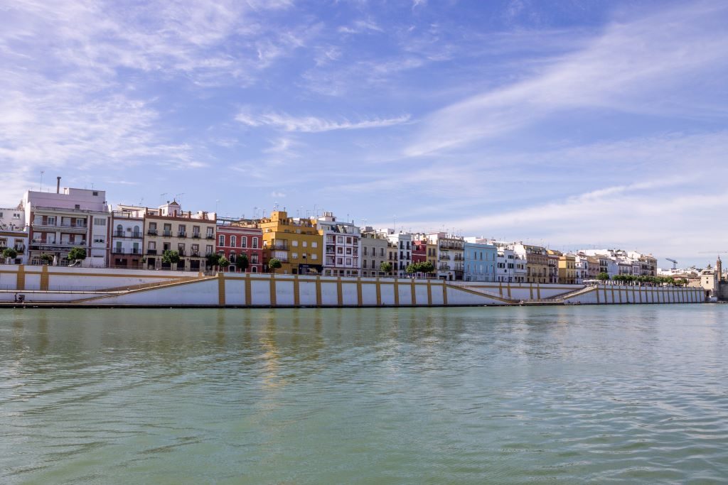 The brightly colored neighborhood of Triana that lays on the riverside of Seville in southern Spain.