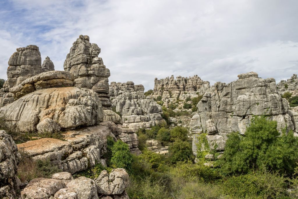 Hiking among the karst formations of the Torcal de Antequera in Andalusia Spain. This can be done as a day trip from almost anywhere in Andalucia, including Seville, Cordoba, Malaga, or Granada