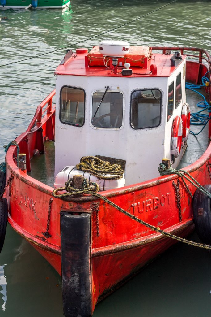 Red boat in Cobh harbor
