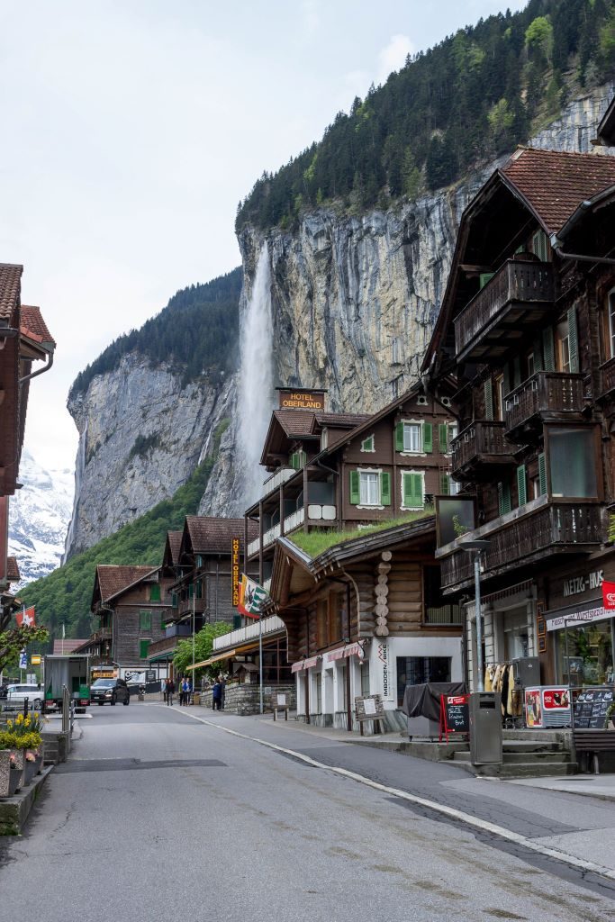 Lauterbrunnen village with Staubbach waterfall in the background. This is one of the best waterfalls in Europe if you are looking for a waterfall with a scenic village.