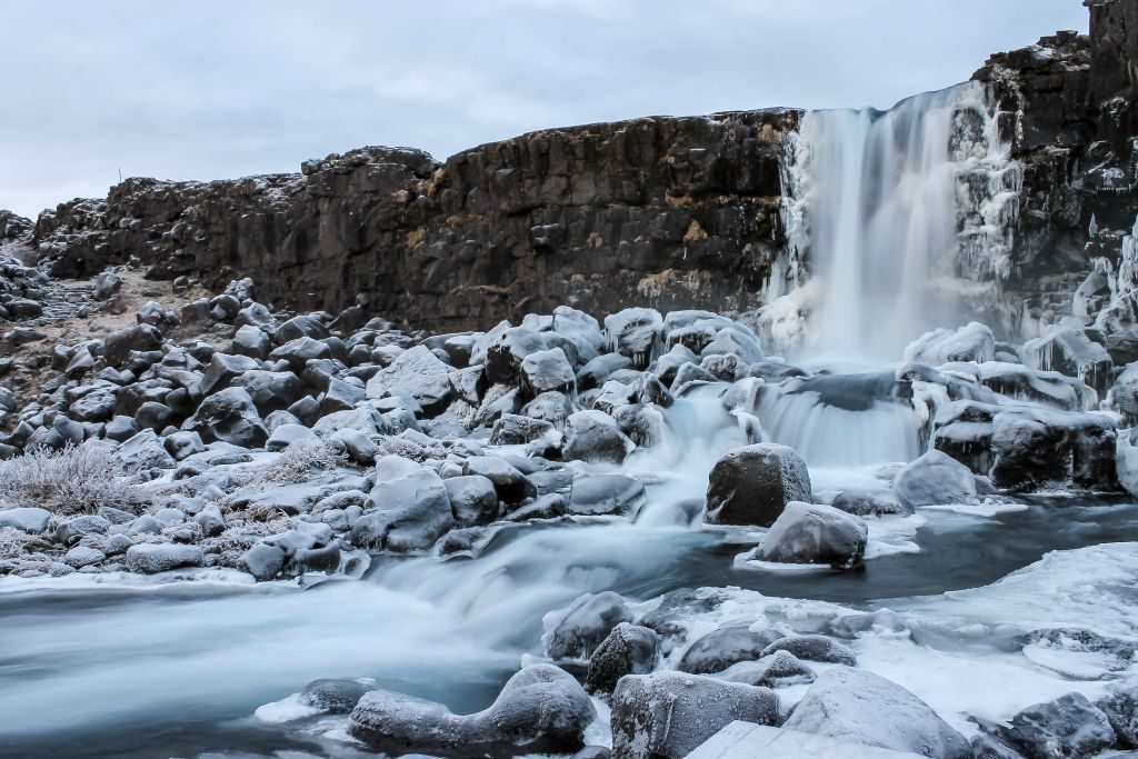 Frozen Oxarafoss waterfall in Thingvellir National Park on the Golden Circle in Iceland