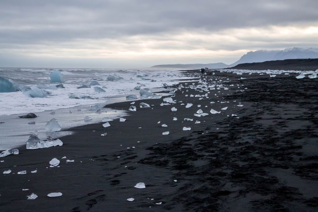 Located just across the road from the Jokulsarlon Glacier Lagoon, Diamond Beach is where some of these glaciers wash up on the black volcanic sand. It leaves ice glittering like diamonds across the beach.