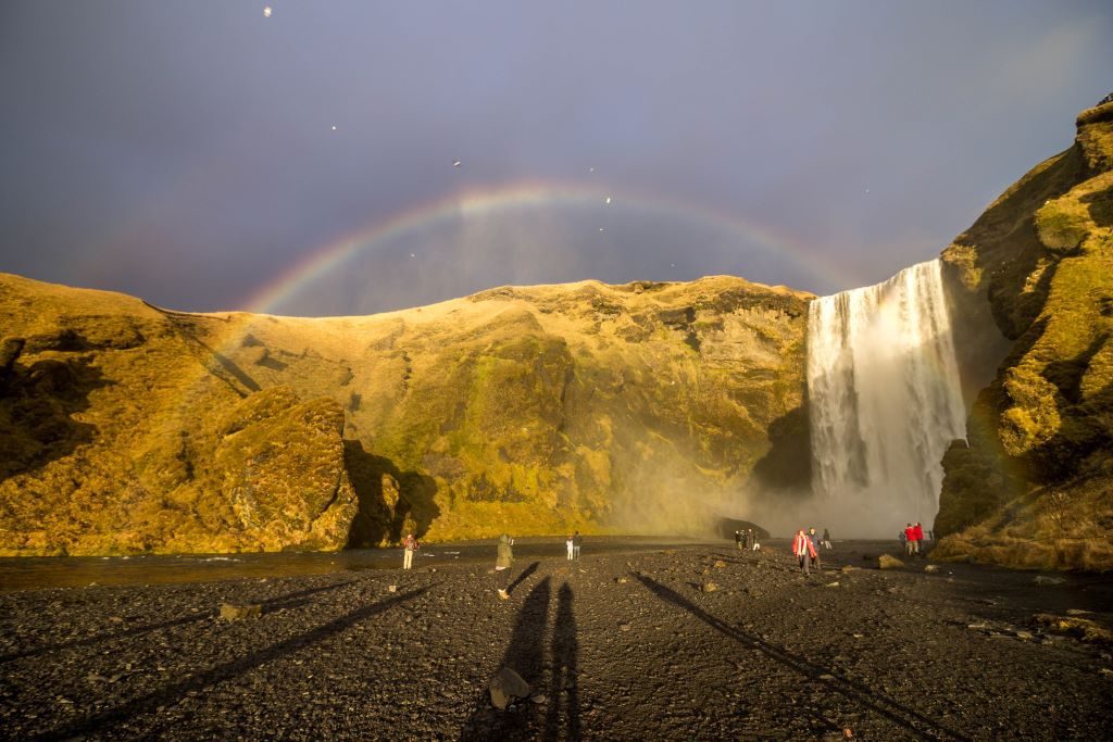 Skogafoss is one of the most beautiful waterfalls you can see on Iceland's South Coast on the Ring Road. Here is Skogafoss at sunrise in November with a rainbow in front of it