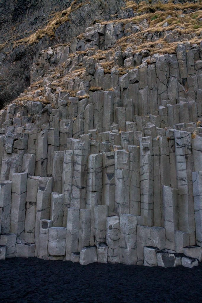 The hexagonal basalt columns at Reynisfjara black sand beach near Vik, Iceland