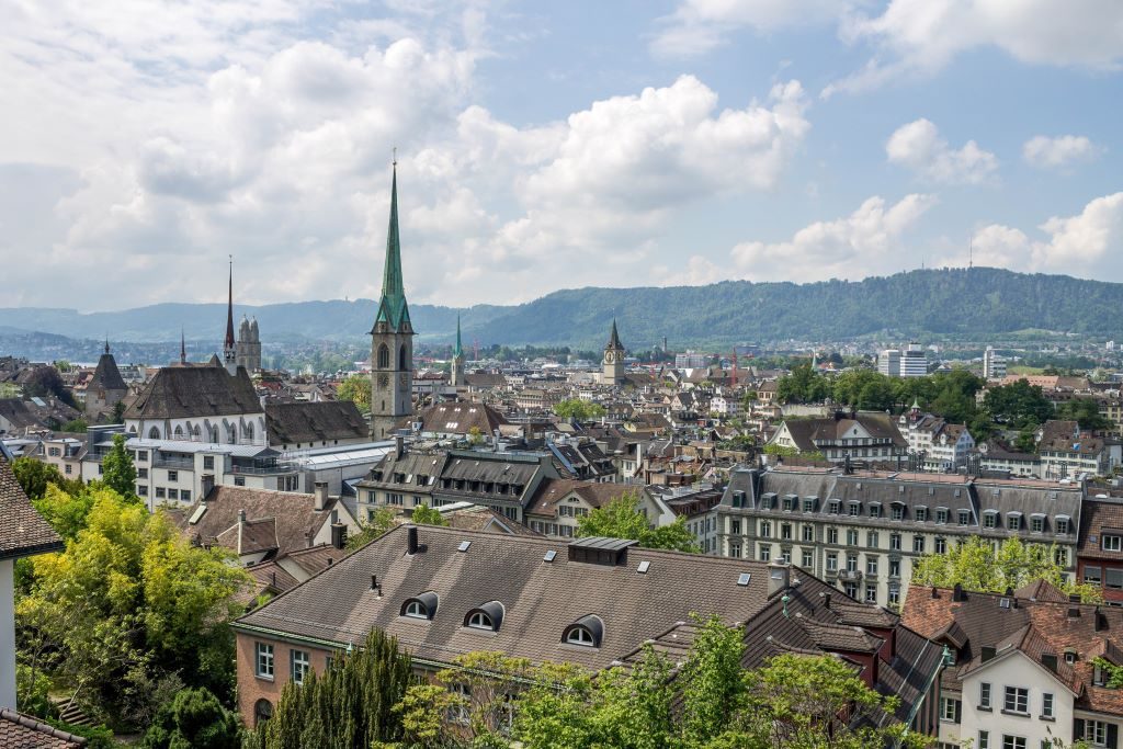 The skyline of Zurich can be seen while taking yourself on a tour of Zurich's best chocolatiers in the city