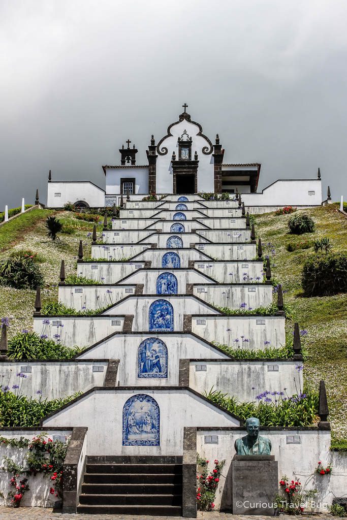 The Nossa Senhora da Paz or Our Lady of Peace Chapel, sits high above towns in the Azores. With many steps up to the chapel to represent prayers