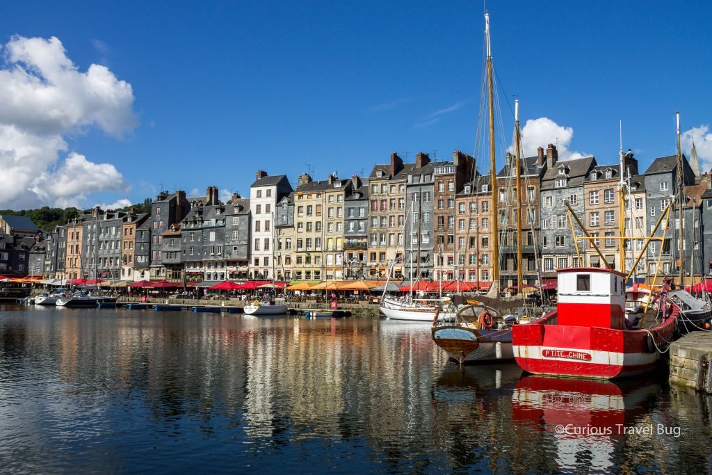 Honfleur, Normandy, France is known for its adorable harbor with tall skinny buildings. It attracted impressionist painters like Monet to paint it.