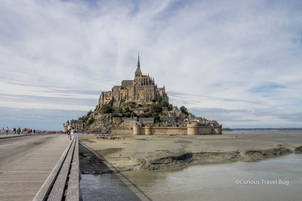 Mont Saint Michel in Normandy at low tide. This fantastic destination is a must for any Normandy itinerary