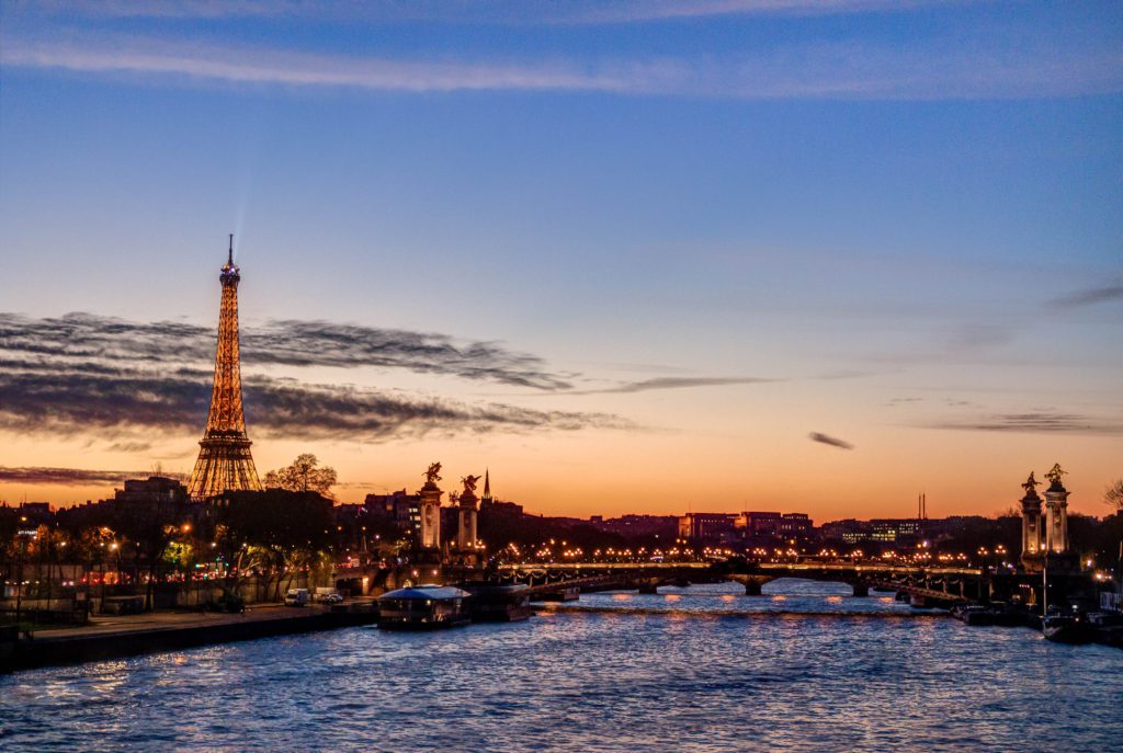 The Paris skyline of the Eiffel Tower and the Seine River. Paris is a great place to visit for the weekend or for 4 days. This is the perfect four day itinerary to Paris to make the most of your time in France