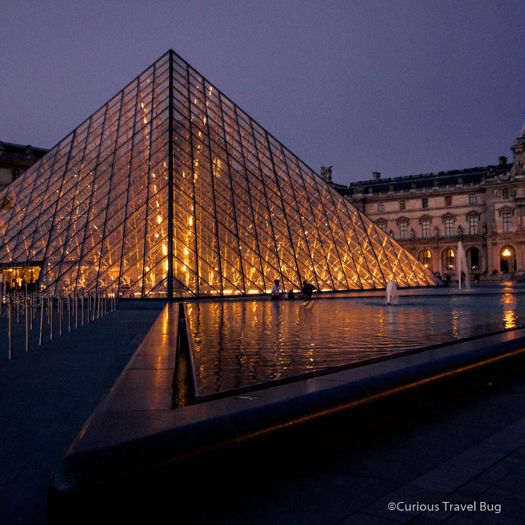 The Louvre's crystal pyramid at nighttime. Even if you don't visit the Louvre, it is worth seeing this lit up in the evening