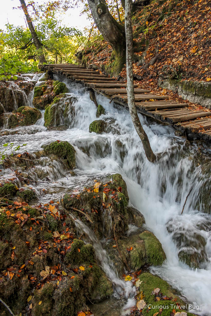 Plitvice Falls Croatia. These waterfalls at Plitvice Lakes rush under your feet as you walk up the boardwalk. It's sights like these waterfalls that make this one of the best national parks in Croatia