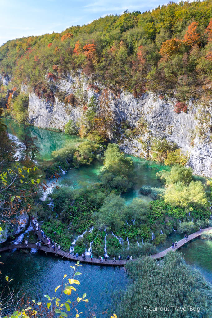 After walking through the cave at Plitvice you get this wonderful view of the lakes of Plitvice, Croatia from above. Plitvice Lake Croatia offers up amazing scenery like this one. You can view this in the lower lakes of Plitvice. The curving boardwalk makes for great photography while hiking Plitvice Lakes