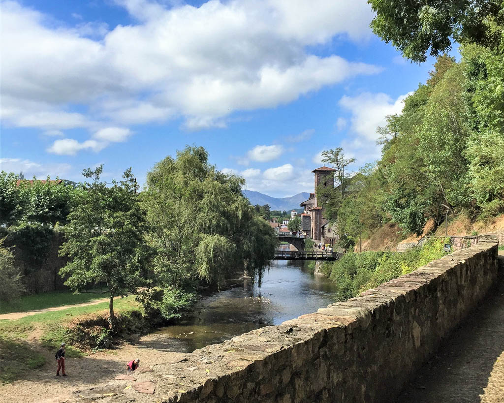 View of the Nive river and stone bridges in Saint Jean Pied de Port, the start of the Camino de Santiago. This town is a great break from the city while offering up lots to do in this must visit town in France.