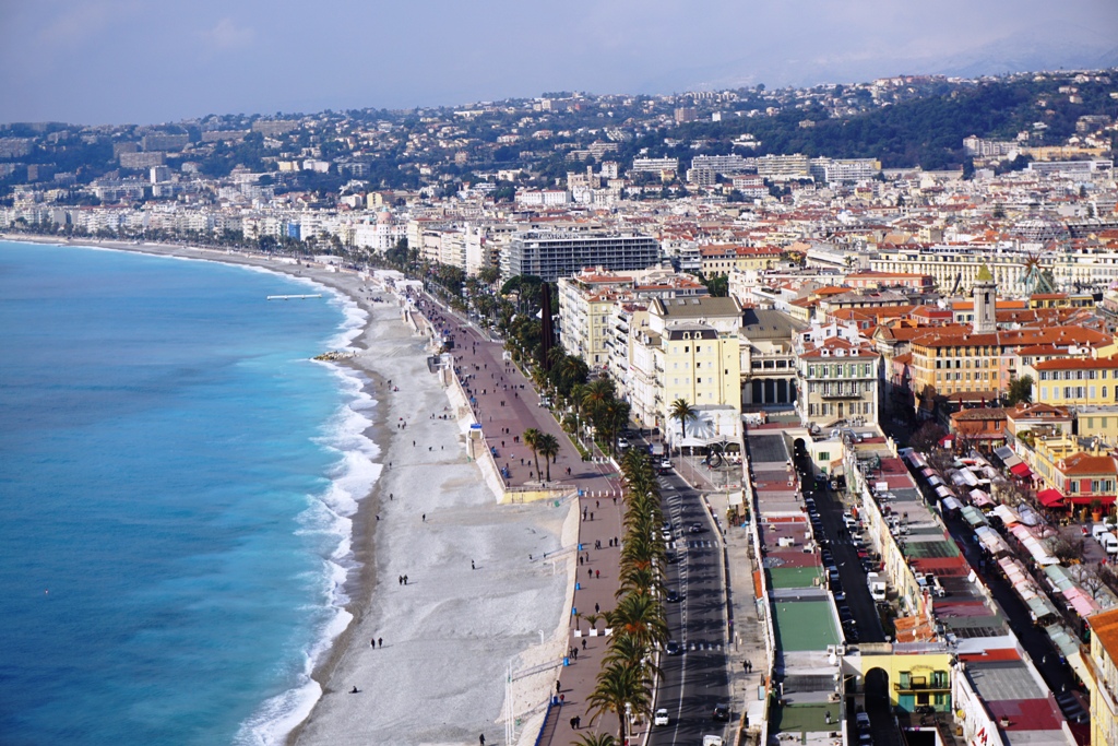 The Mediterranean Sea and the colourful buildings in the southern France city of Nice. This city is easily accessible by train and plane and offers up tons of things to do in Nice.