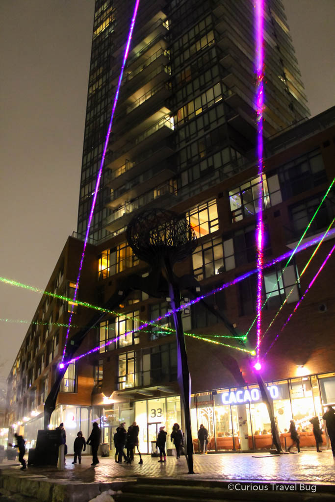 Lasers light up the giant spider statue in the Distillery District of Toronto during the Light Festival