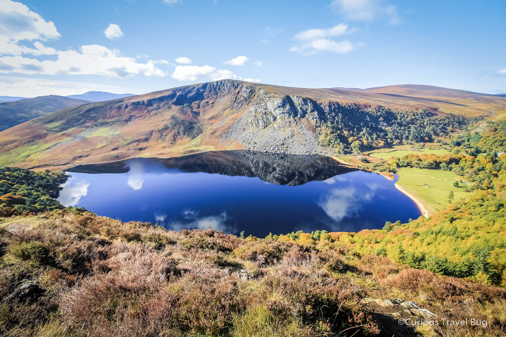 Guinness Lake or Lough Tay in Wicklow Mountains National Park, Ireland. This lake got its name for its beach creating the look of a Guinness beer. It's one of the most popular stops on a day trip to Wicklow.