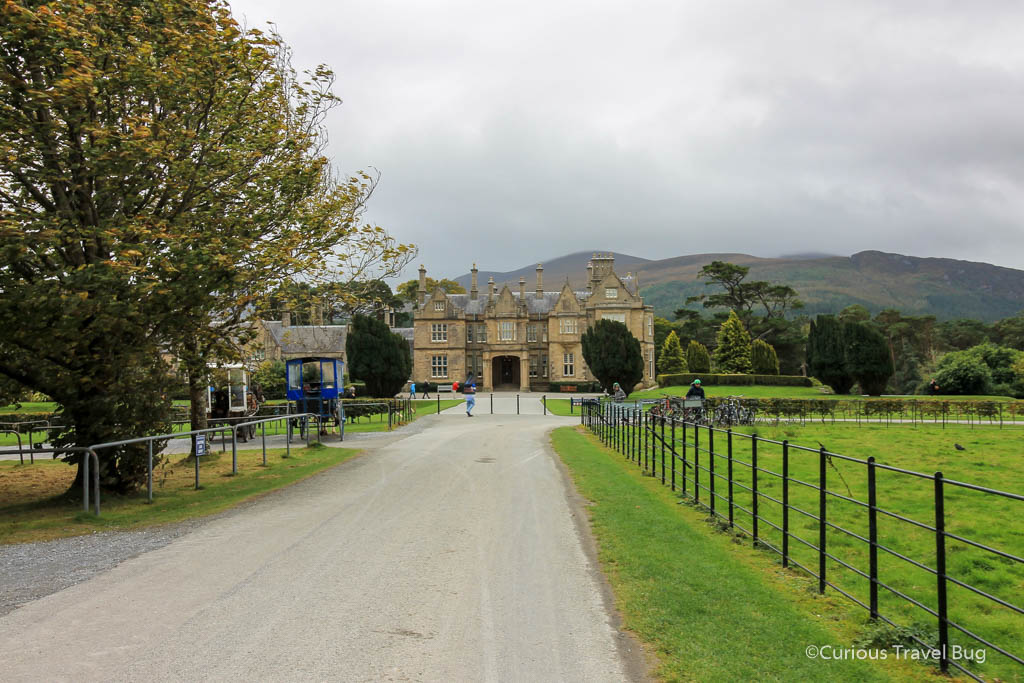 Muckross House with Torc Mountain in the background. Muckross House is one of Killarney's most popular things to do. It's easy to spend an afternoon on the grounds.