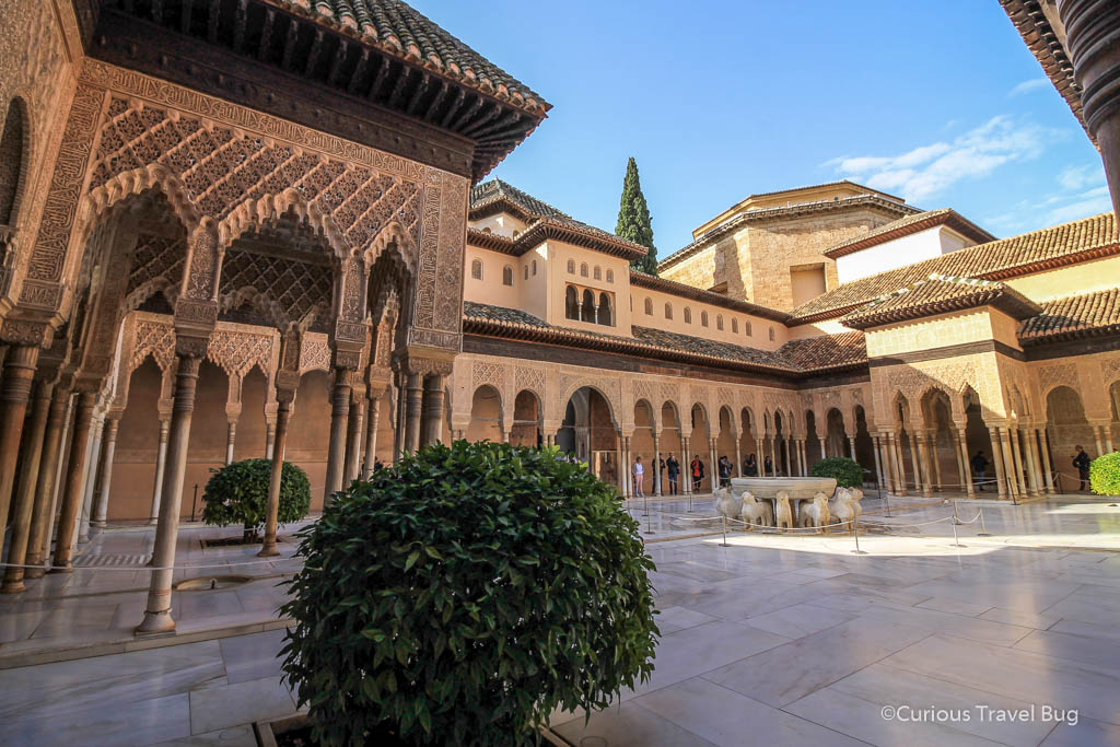 View inside a courtyard of the Nasrid Palace that is part of the Alhambra complex. The Alhambra sits high above Granada Spain and is one of Andalusia's top sights.