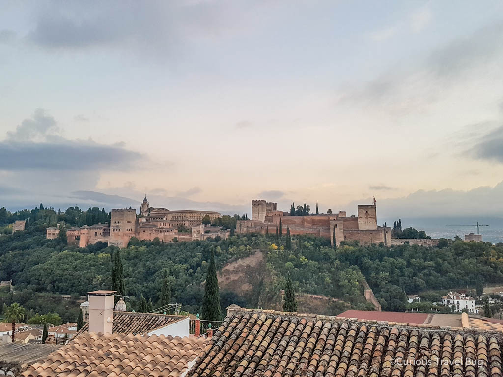 View of the Alhambra from Mirador de San Nicolas in Granada. This viewpoint is one of the top things to see in Granada, Spain.