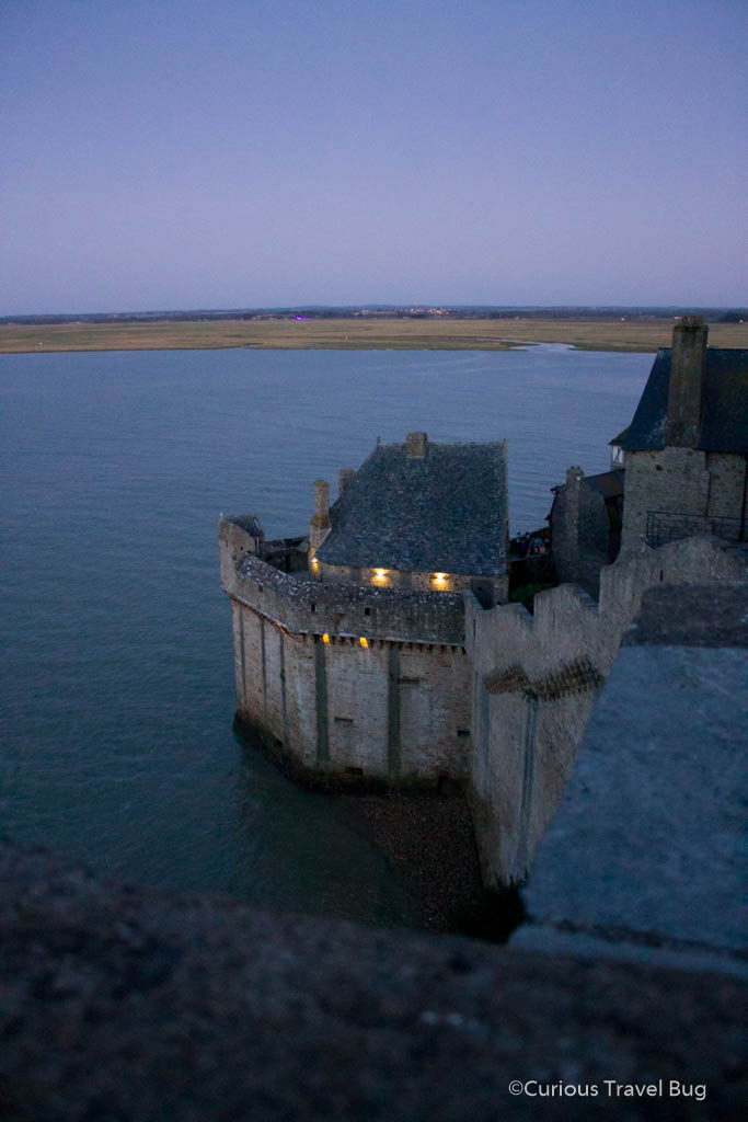 View of Mont Saint Michel at night with high tide. The tide can become so high that it is an island.
