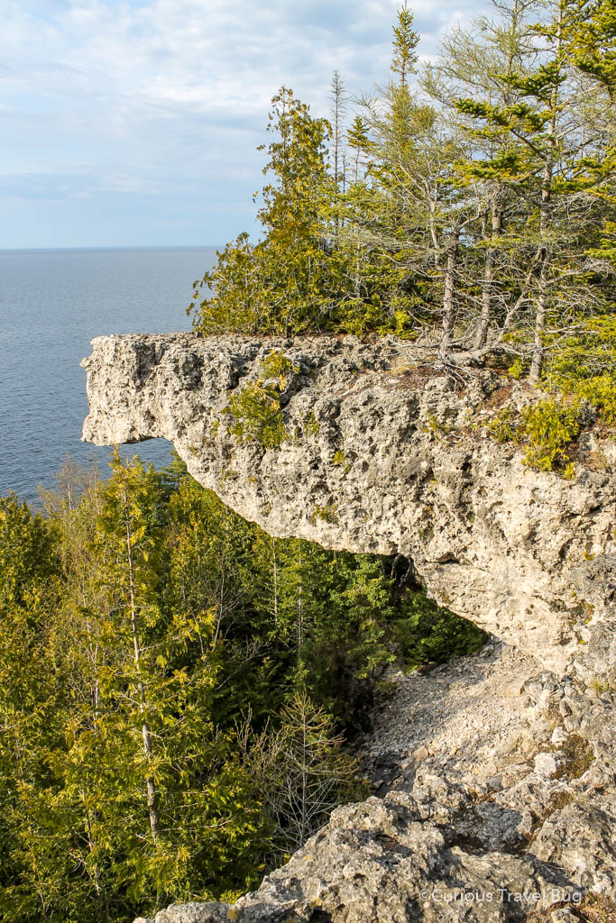 Overhanging Point in the Bruce Peninsula. An overhanging cliff that is surrounded by cedar and spruce trees on the Bruce Trail in Ontario, Canada