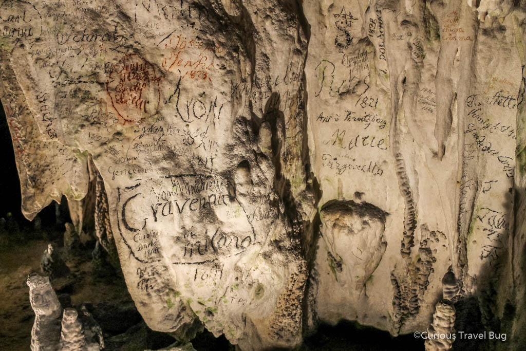 Signatures on Postojna Cave Walls. It used to be very acceptable and an honor to visit and sign the cave.