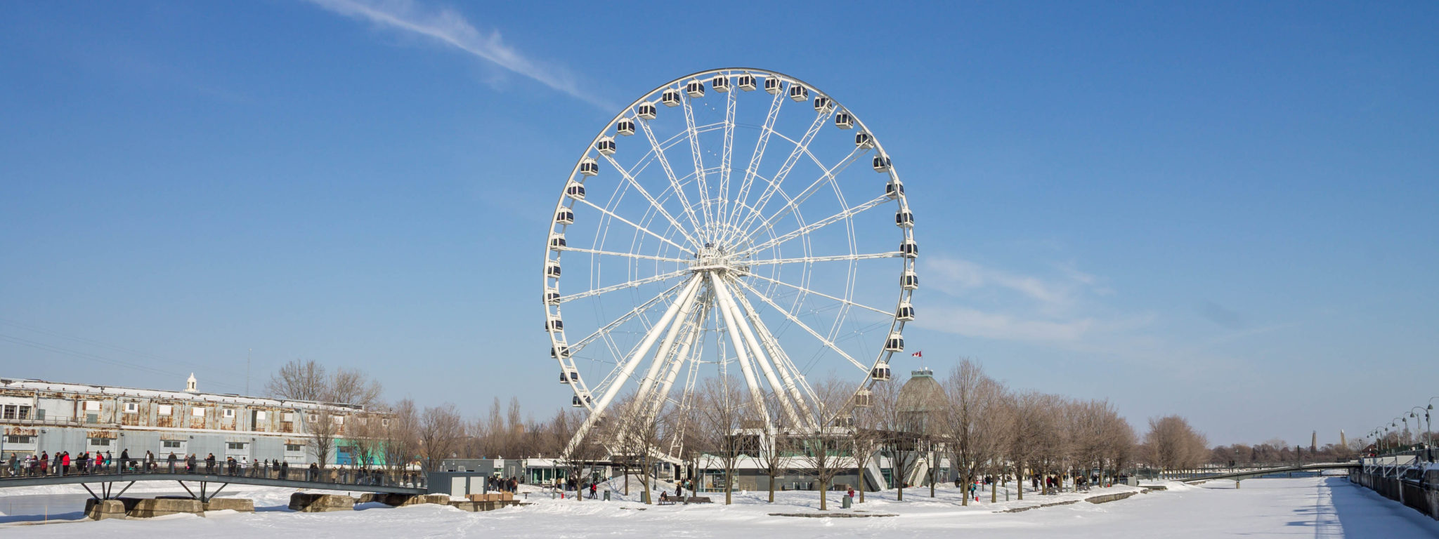 Old Port of Montreal with the Observation Wheel. This is a must visit area of Montreal and perfect for first time visitors to Montreal to explore.