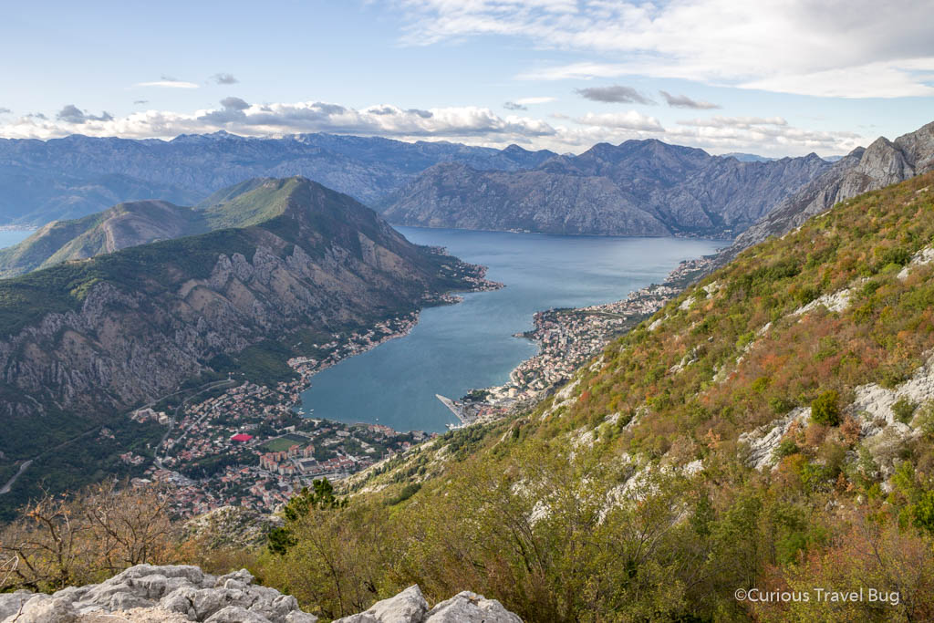View of Kotor Bay from above. One of the must do things in Kotor if you only have one day is to drive the serpentine roads above Kotor for fantastic views of the bay and town. This is one of the best views in the Balkans and is perfect for a day trip from Dubrovnik or overnight in Montenegro.