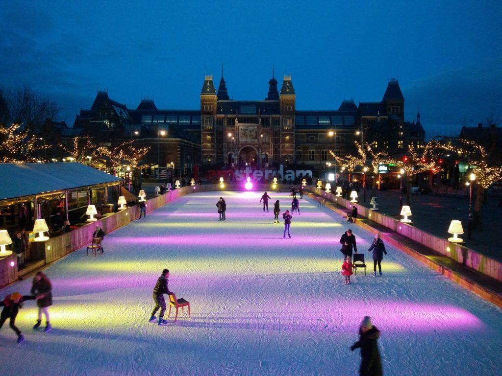 Ice skating outside of the Rijksmuseum in Amsterdam, Netherlands. This is one of the best skating rinks in the city and is part of the Ice*Amsterdam festival that is held there in the winter.