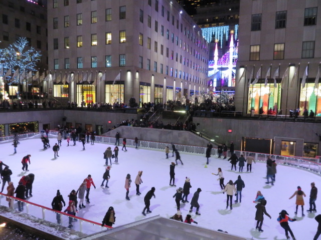 Ice skating on the rink at Rockefeller Center in New York City. This is one of the most iconic ice rinks in the world, appearing in many holiday movies and tv shows. It's a beautiful experience at Christmas time when the Christmas tree is up.