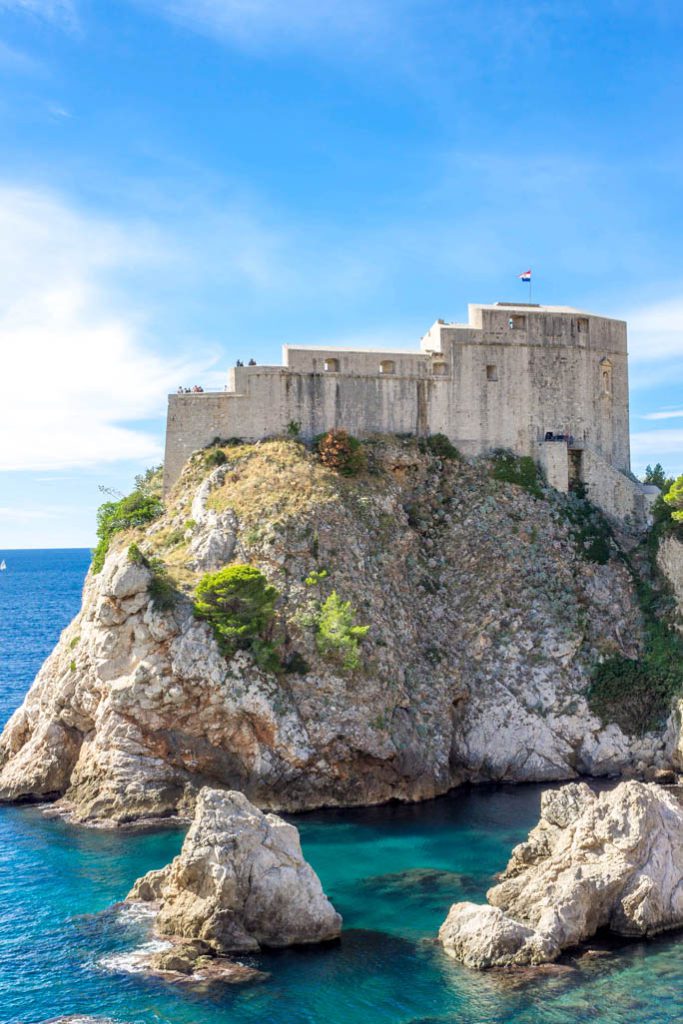 A castle like fort sits over the Adriatic Sea in Dubrovnik, Croatia