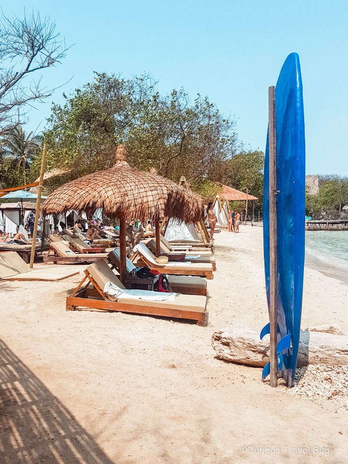 Beach with loungers on the Caribbean Coast of Colombia, on the Rosario Islands. This is one of the best places to visit in Colombia and so easy to add to an itinerary