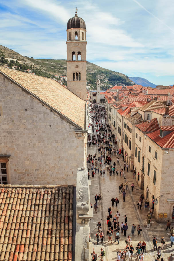 The busy streets of Dubrovnik's old town with orange tiled roofs and shiny marble like streets. This is a must visit stop on any Croatia itinerary