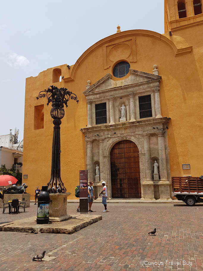 Plaza de Santo Domingo with a Botero statue in it and a big yellow church