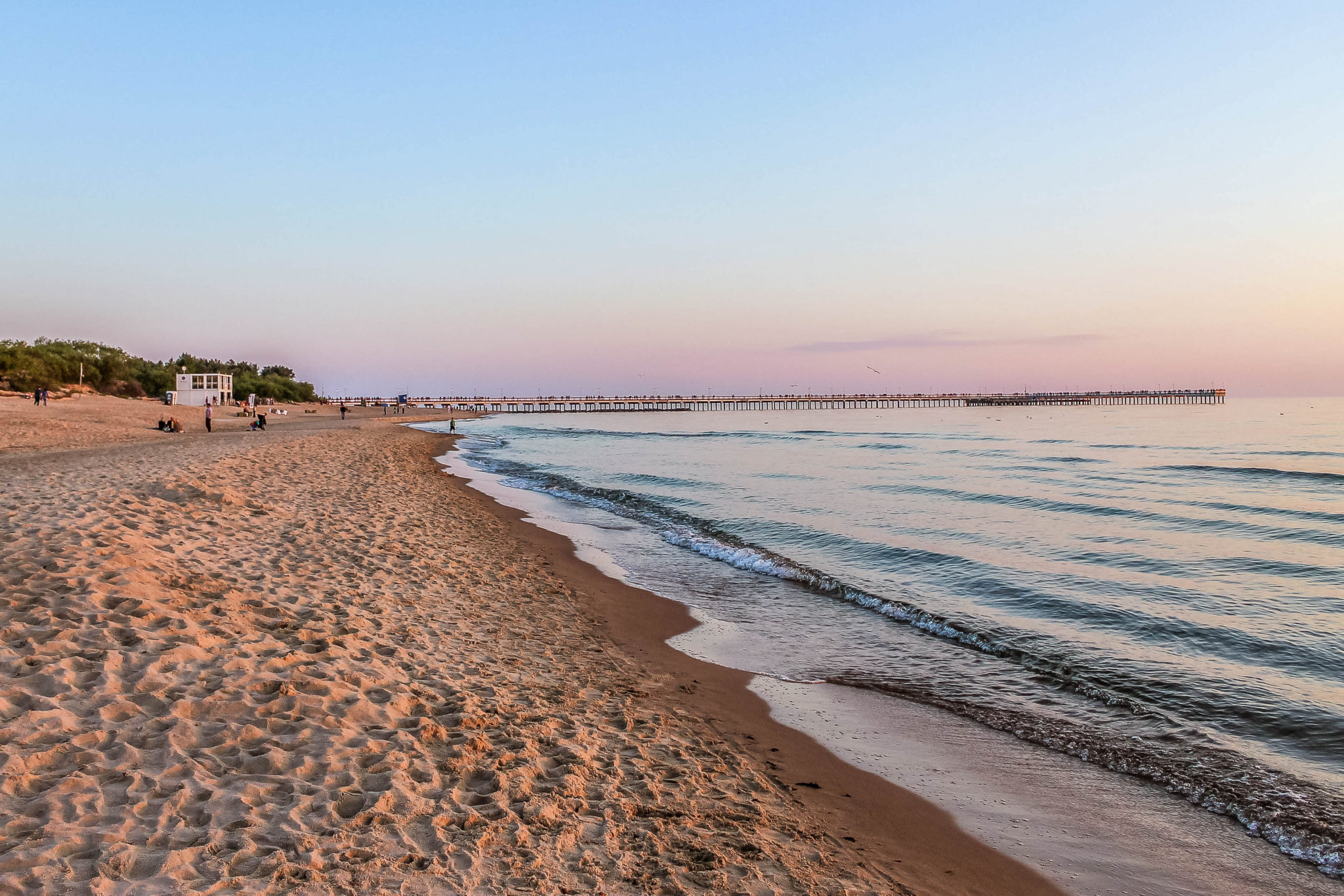 The soft white sand of Palanga beach at sunset on the Baltic Sea