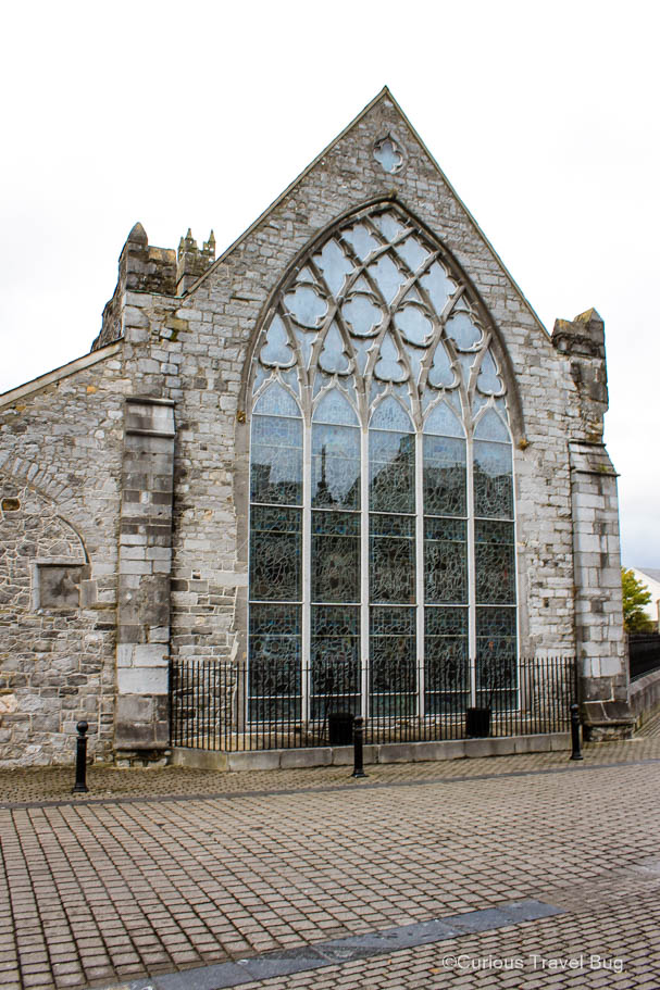 The large stain glassed window of the Black Abbey in Kilkenny, Ireland.