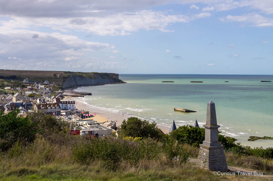 View over Arromanches-les-Bains with the artificial port still visible in the Atlantic ocean.