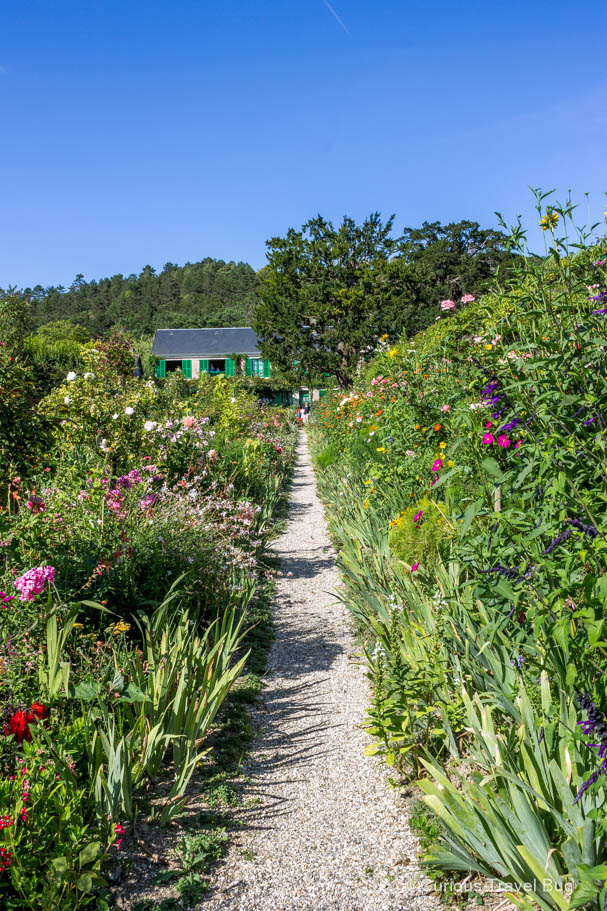 A path in Monet's Gardens in Giverny, France. This charming garden in Normandy once belonged to Claude Monet who lived there for 43 years, carefully curating and designing the gardens.