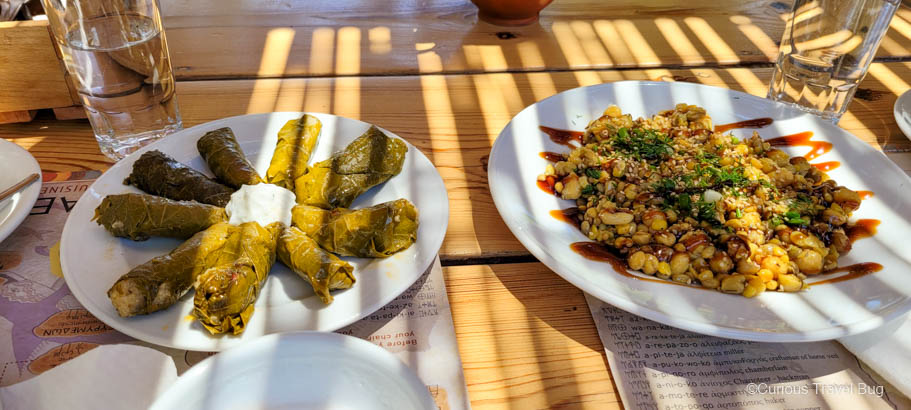 A plate of dolmades (flavoured rice wrapped in grape leaves) and Minoan Salad in Knossos, Crete.
