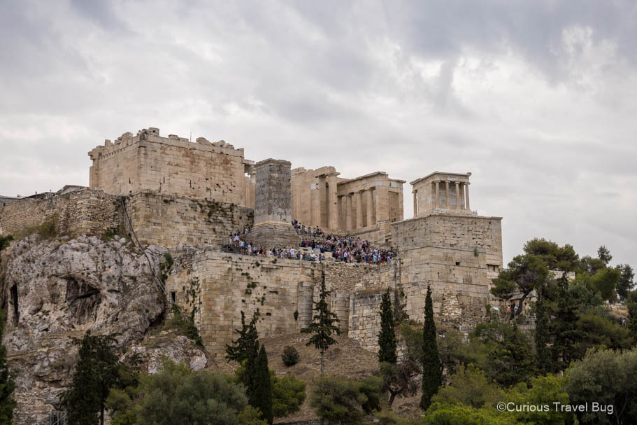 View of the Propylaia, monumental ceremonial entrance to the Acropolis from Areopagus Hill during midmorning with lots of people.